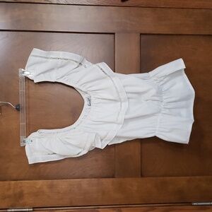 Off the shoulder ruffled neck top with gathered waist.